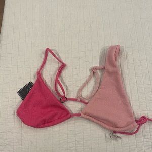 Pink bikini top. Tags still on. Never worn. Size small